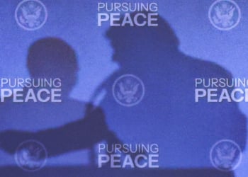 The shadows of U.S. President Donald Trump and Russian President Vladimir Putin are cast during a press conference following their meeting to negotiate an end to the war in Ukraine, at Joint Base Elmendorf-Richardson, in Anchorage, Alaska, U.S., August 15, 2025. REUTERS/Kevin Lamarque TPX IMAGES OF THE DAY