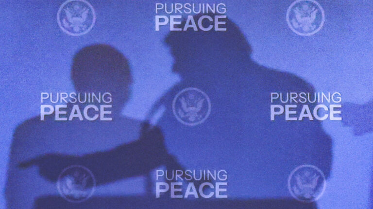 The shadows of U.S. President Donald Trump and Russian President Vladimir Putin are cast during a press conference following their meeting to negotiate an end to the war in Ukraine, at Joint Base Elmendorf-Richardson, in Anchorage, Alaska, U.S., August 15, 2025. REUTERS/Kevin Lamarque TPX IMAGES OF THE DAY