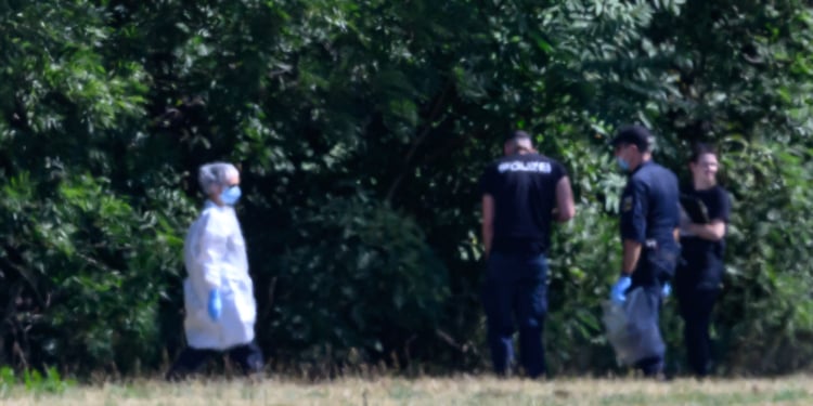 Police forensic investigators collect evidence in a field near the Leipzig/Halle Airport. DPA / Picture Alliance