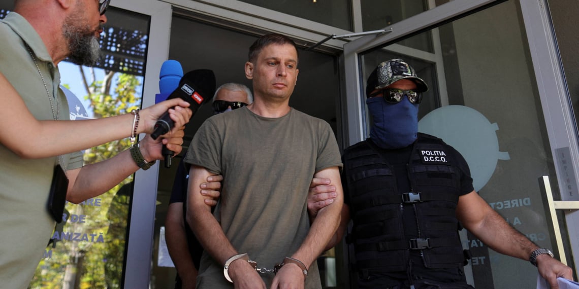 A Russian citizen believed to be involved in a thwarted sabotage operation coordinated by Russia on Romanian territory, according to Romania's SRI intelligence,is escorted outside the DIICOT (Romanian anti-organised crime prosecuting unit) headquarters, in Bucharest, Romania, September 8, 2026 via REUTERS