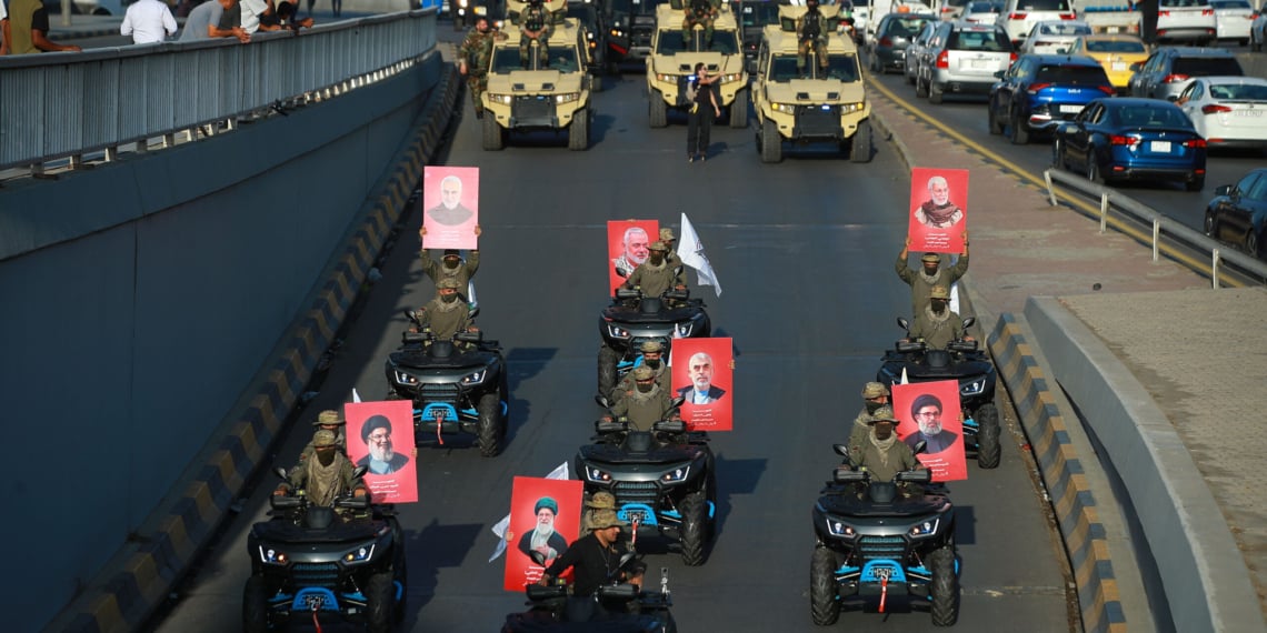 Members and supporters of Iraq's Iran-backed Popular Mobilization Forces mark the withdrawal of U.S. forces from Iraq. dpa via Reuters Connect